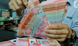 Rupiah Tembus 18.083 per Dolar AS, Pasar Fokus Menanti The Fed